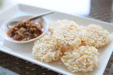 Thai food rice crust with pork spicy sauce