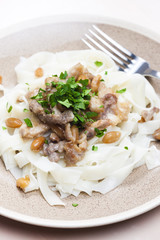 chicken, beef and pork meat with peanuts and rice noodles
