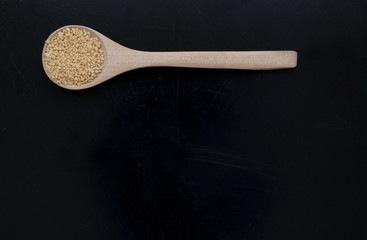 Couscous -  wooden spoon - studio shot from above