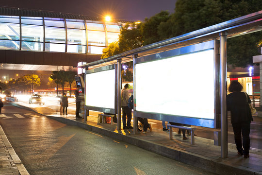 Night Bus Station With Blank Billboard