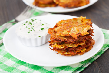 Potato pancakes with sour cream
