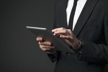 Cool businessman using touchpad