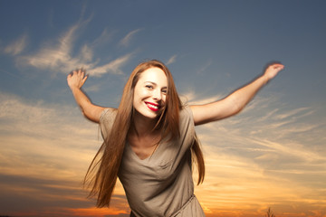 Fototapeta na wymiar Beautiful, happy young woman in sunlight