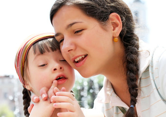 Happy family moments - Mother and child have a fun.