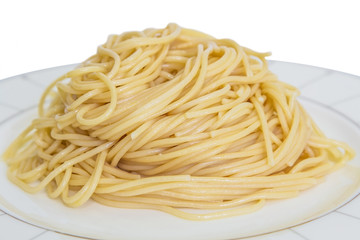 Freshly cooked spaghettii on a white plate.