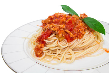 Spaghetti with tomato sauce on a plate .