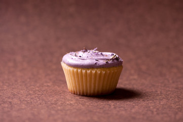 Vanilla muffin with raspberry cream topping and sweet flavors