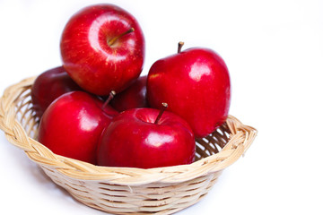 Apples in a yellow basket.