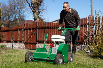 Man working with Lawn Aerator