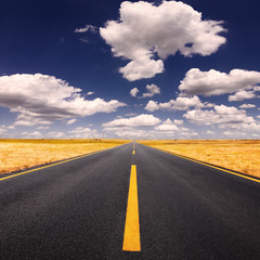 Fototapeta premium Driving on asphalt road at lovely sunny day