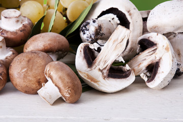 Still life of mushrooms and raw mushrooms