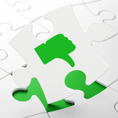 Social network concept: Thumb Down on puzzle background