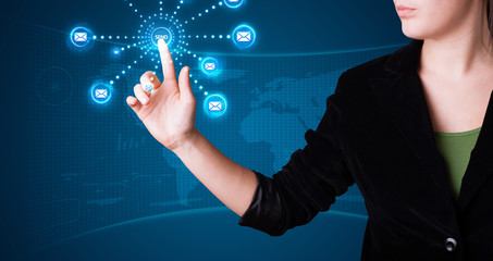 Woman pressing virtual messaging type of icons