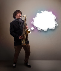 Fototapeta na wymiar Young man playing on saxophone with copy space in white cloud