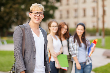 teenage boy with classmates on the back