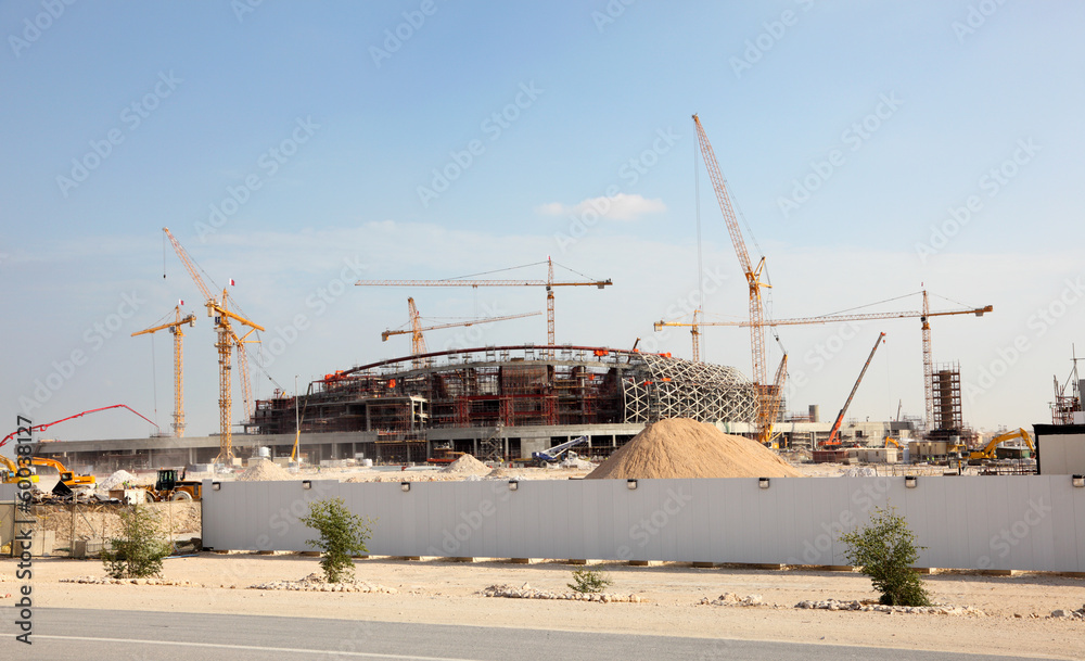 Wall mural Construction of a stadium in the desert of Qatar, Middle East