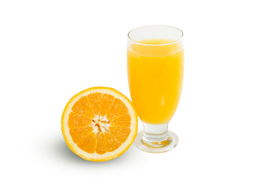 Glass of fresh orange juice with sliced oranges on white backgro