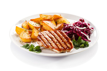 Grilled steak, baked potatoes and vegetables
