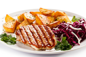 Grilled steak, baked potatoes and vegetables