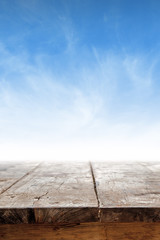 Empty table against blue sky