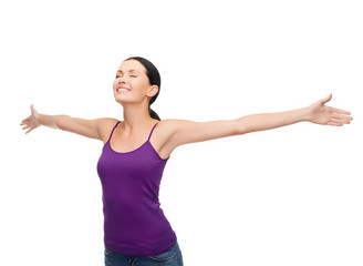 smiling girl in blank purple tank top waving hands