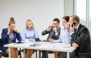 business team with smartphones having conversation