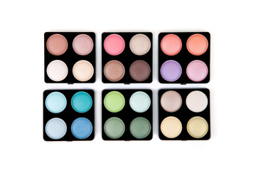 Six eyeshadow palettes isolated on white