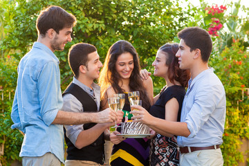 Teenage friends celebrating at a birthday party.