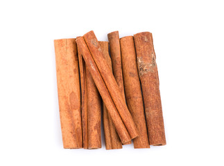 Cinnamon sticks top view, isolated on white background