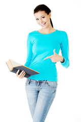 Young woman student with book.