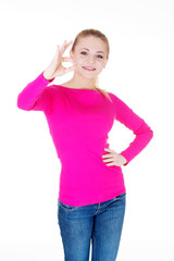 Fototapeta premium young casual woman student showin OK gesture.