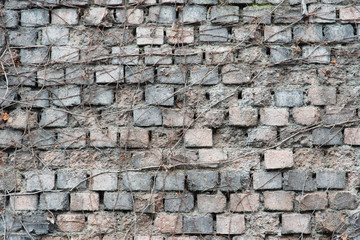 old brick wall of gray and pink
