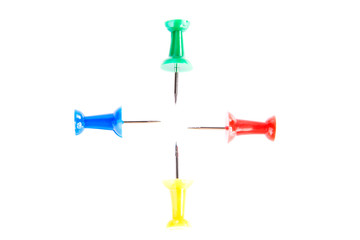 Four colorful drawing pins.