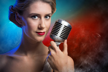 attractive female singer with microphone