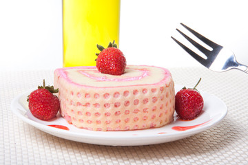 Strawberry Roll Cake with drink and fork