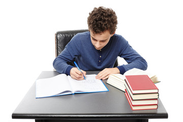  Student sitting at his desk focused and doing his homework