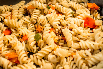 Pasta with tomatoes and cheese.