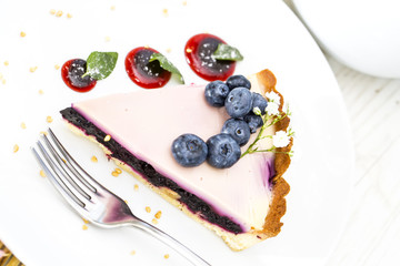 piece of blueberry pie on a table in a restaurant