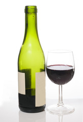 bottle of red wine with glass on white background