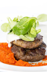 baked meat in a sauce of peppers and tomatoes