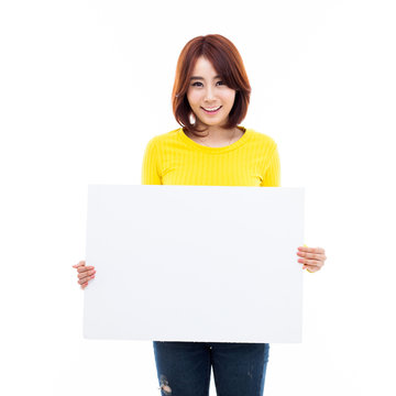 Young Asian woman holding a white borad