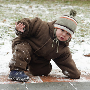 Child on slippery pavement