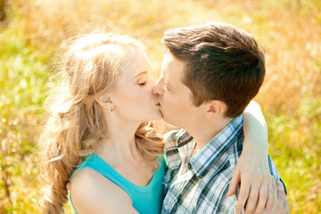 Happy young adult couple in love on the field. Two,  man and wom