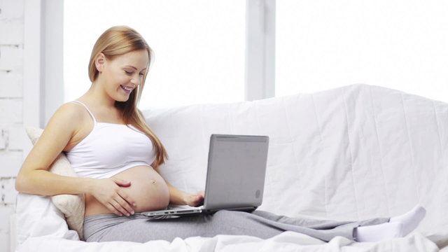 pregnant woman with laptop computer