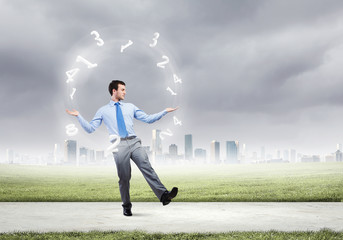 Businessman juggler