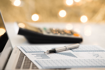 Businessman analyzing investment with laptop