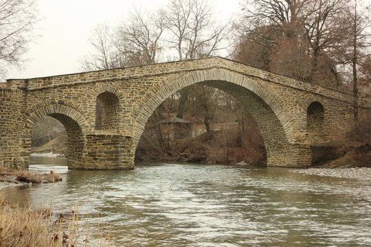 Zakas  arch stone ottoman Bridge and river near Grevena in Greece