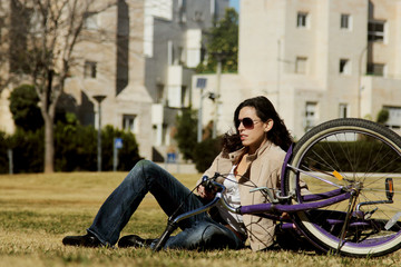 Fototapeta na wymiar woman with retro bicycle in a park