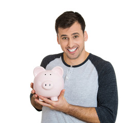 Fototapeta na wymiar Portrait young man holding piggy bank, white background 