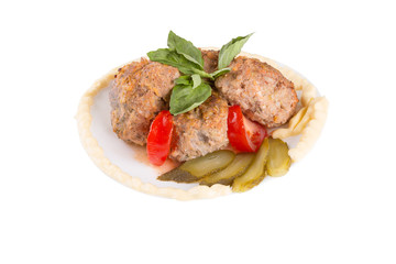 lula lamb and tomato on a plate